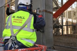 M Hall Diamond Drilling employee removing concrete