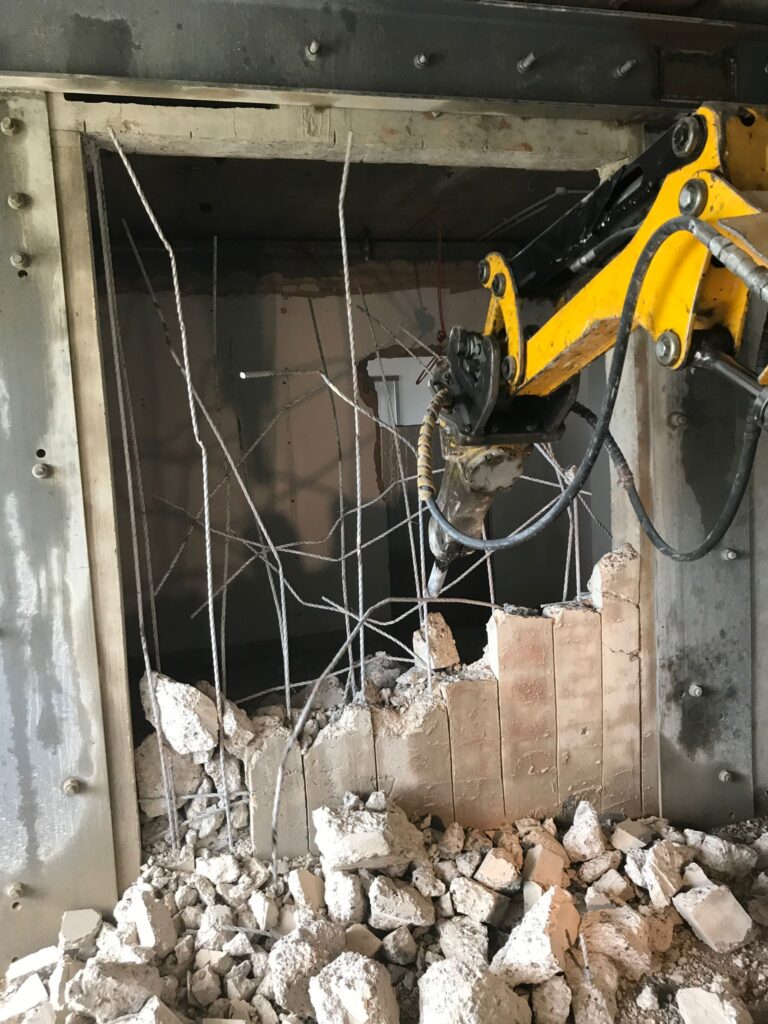 Advanced Brokk demolition machine in action, showcasing its precision and efficiency in tackling complex concrete structures